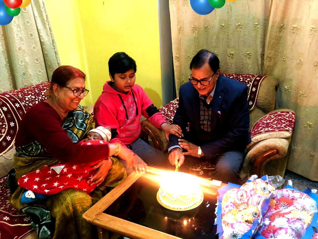 Dr.Madhepuri along with Aditya cutting Birthday Cake.